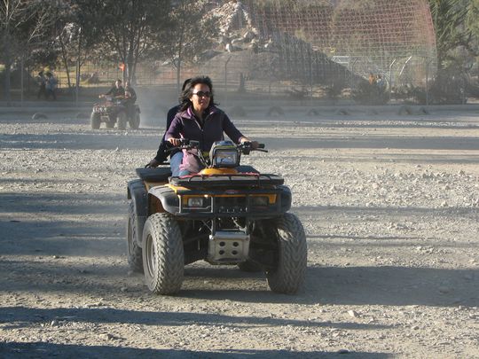 Nataly on an ATV in the park next to the zoo