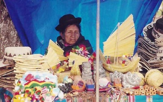 Dozing cholita waiting for the next tourist buyer