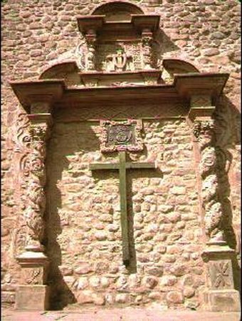 Cross on a church facade Cross on a church facade