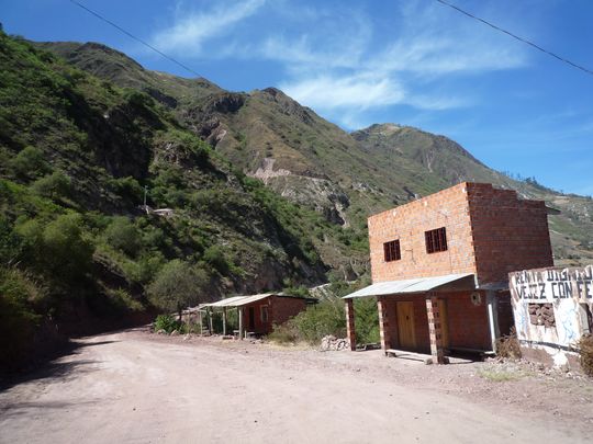 Houses on the road below the cave