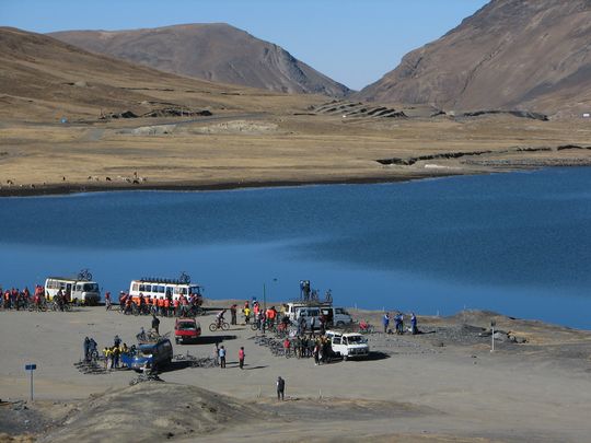 Tourists gathering near laguna Estrellani, before cycling down to the Yungas